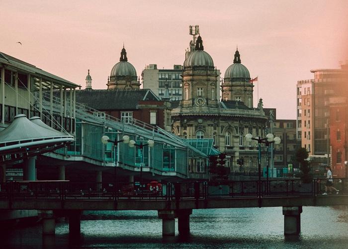 Historic architecture of the Maritime Museum building in Hull, contrasted with the modern Princes Quay building in the foreground.