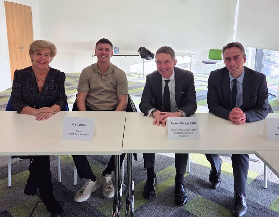 Four people sat at a table.