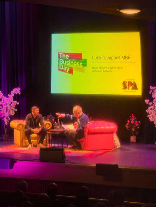 A photograph of the Mayor being interviewed by Gyles Brandreth